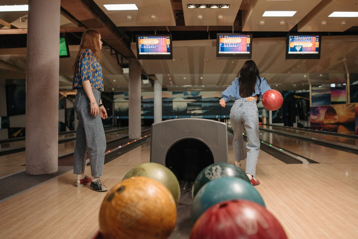 Friends enjoying a game of bowling